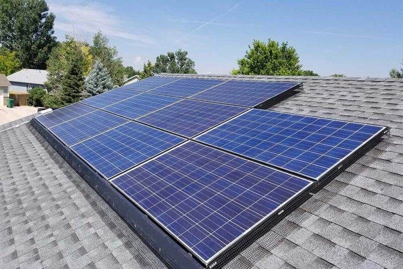 Solar panels installed on the rooftop of a charming brick house, harnessing renewable energy from the sun to power the home.