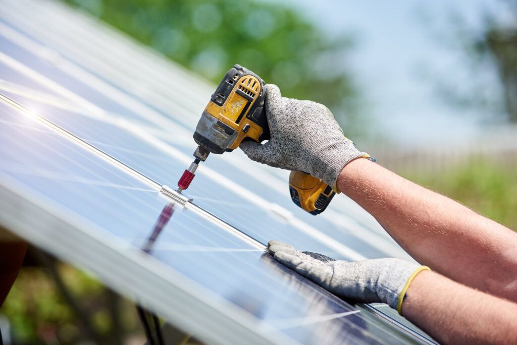 Solar panels installed on the rooftop of a charming brick house, harnessing renewable energy from the sun to power the home.