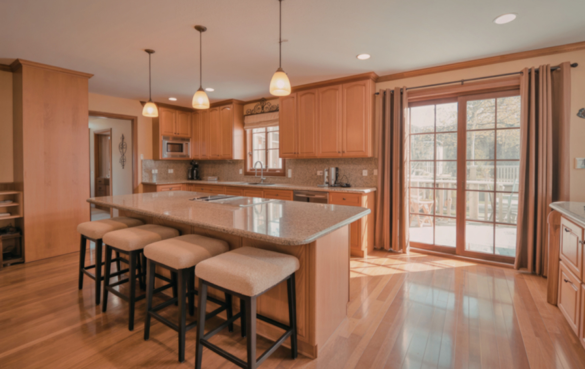 A technician uses a rotating brush tool to clean a round ceiling air duct.