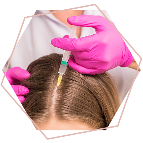 A woman is getting an injection in her hair.