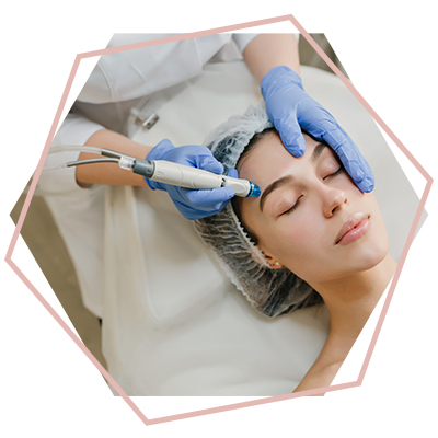 A woman is getting a facial treatment at a beauty salon.