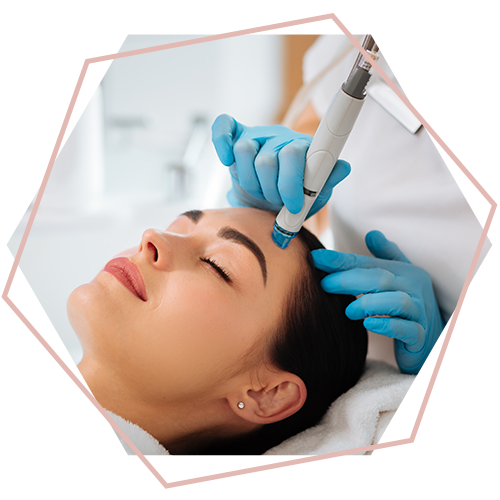 A woman is getting a facial treatment at a beauty salon.