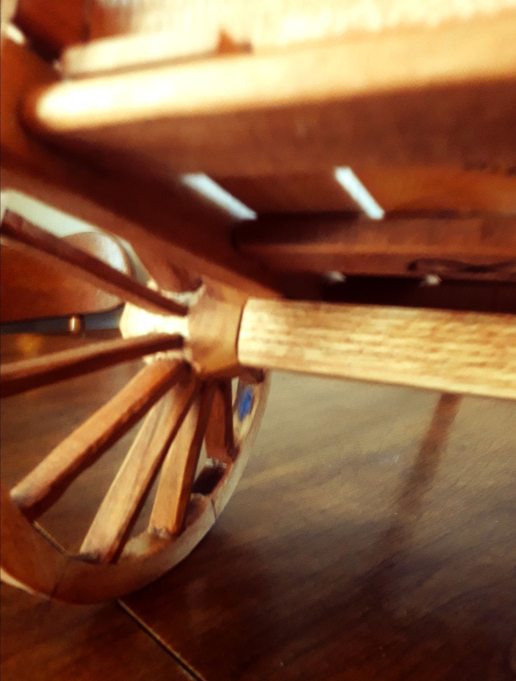 The Axle and wheel of a handcrafted Red River Cart Replica