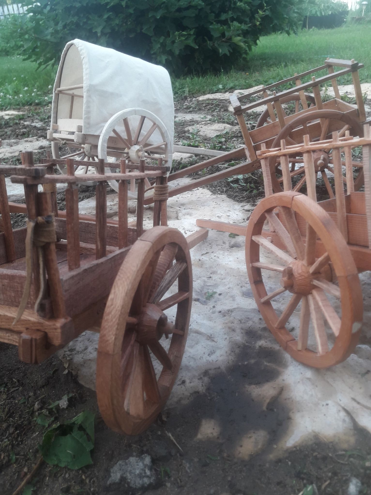 A group of red river carts circled together
