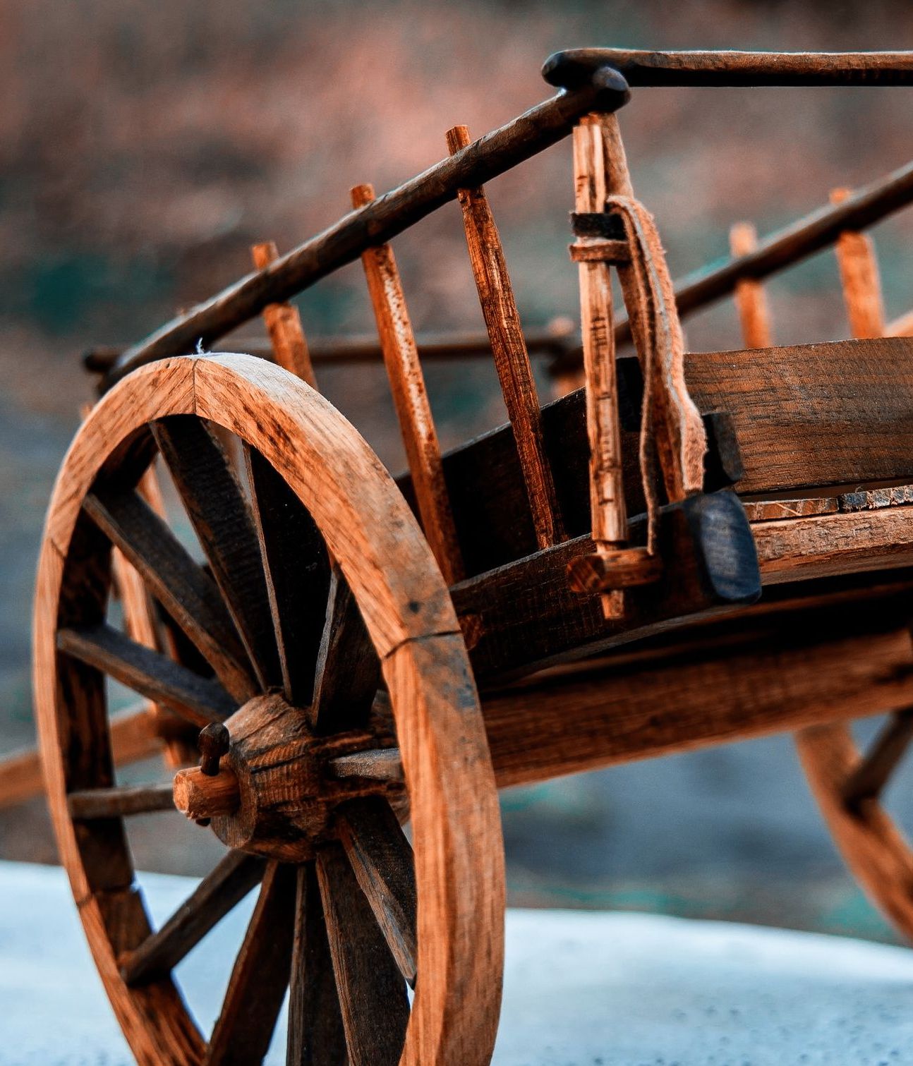 Close up of the back of a Red River Cart replica and its leather tie.