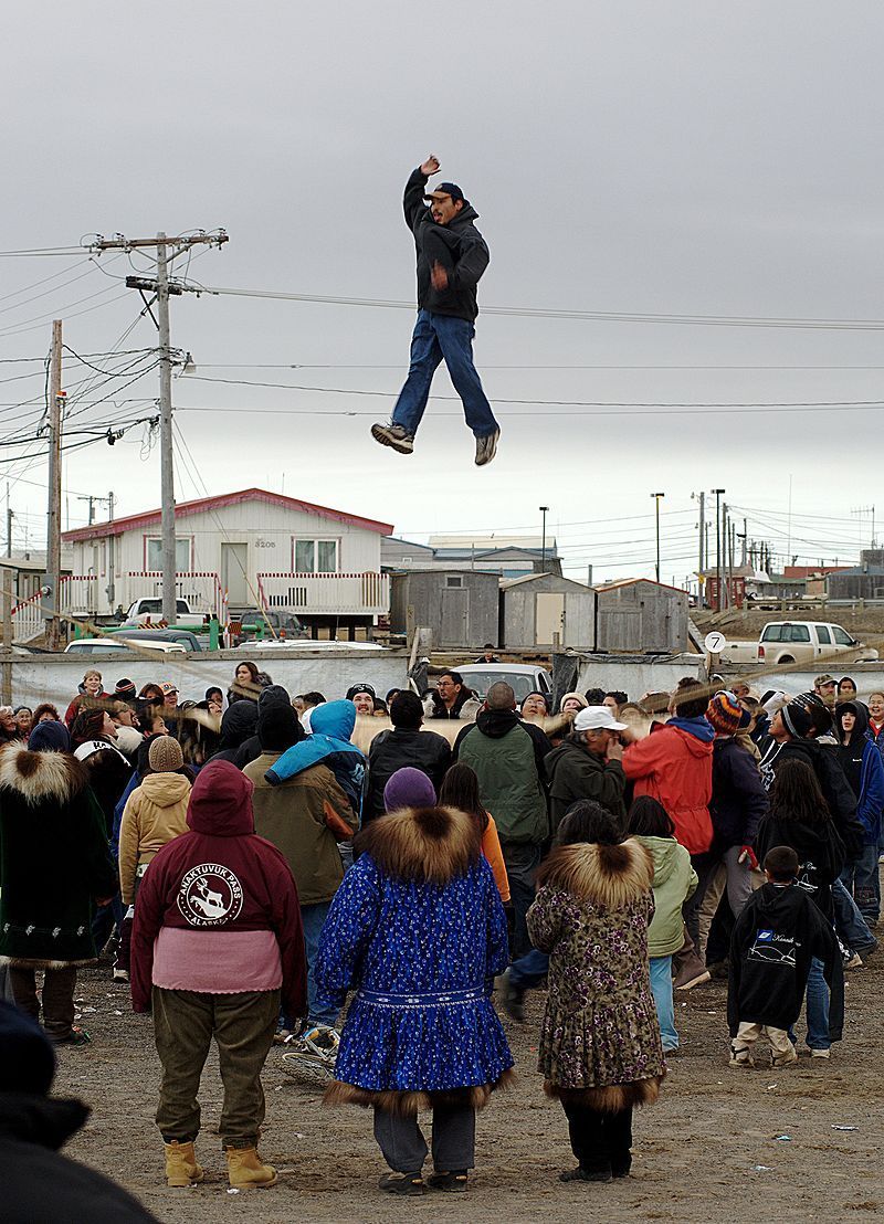 By Floyd Davidson - Nikon and magic, CC BY-SA 3.0, https://commons.wikimedia.org/w/index.php?curid=2951389 Inuit/Inuk participants playing Naluktaq blanket toss in Barrow Alaska