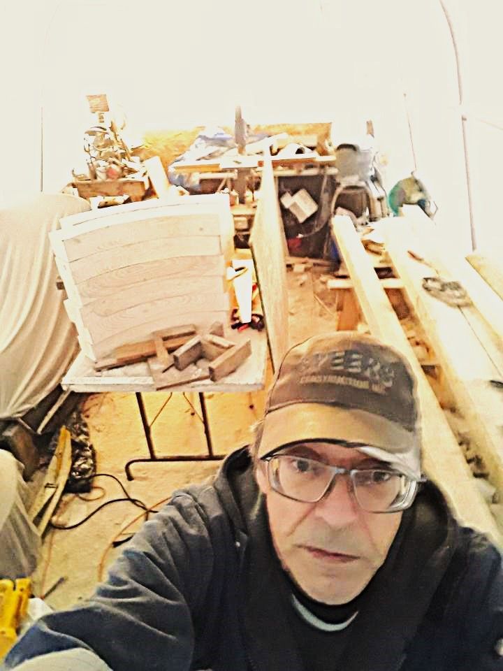 Garry Patterson taking a selfie in his shop working on a half size Red River Cart build