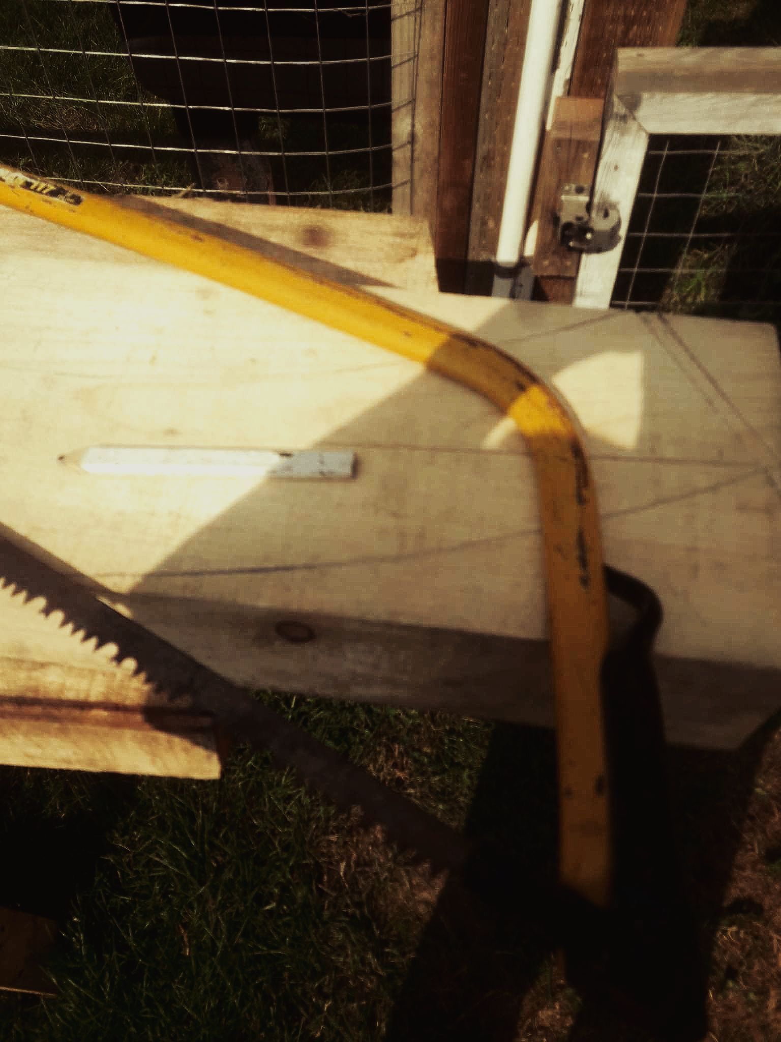  Reclaimed wood and a handsaw for building a Red River Cart.