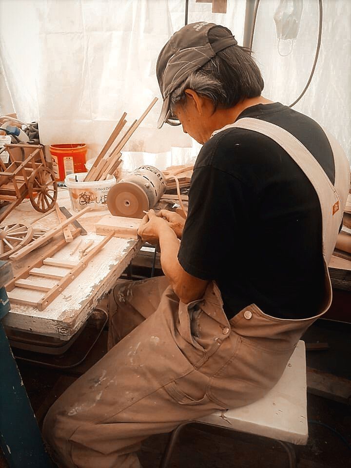 Garry Patterson in his workshop crafting Red River Cart replicas.