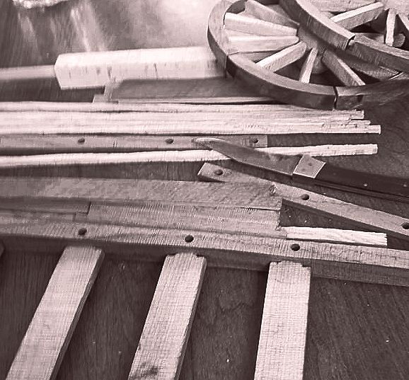 Reclaimed wood being made into pieces for the Red River Cart replicas
