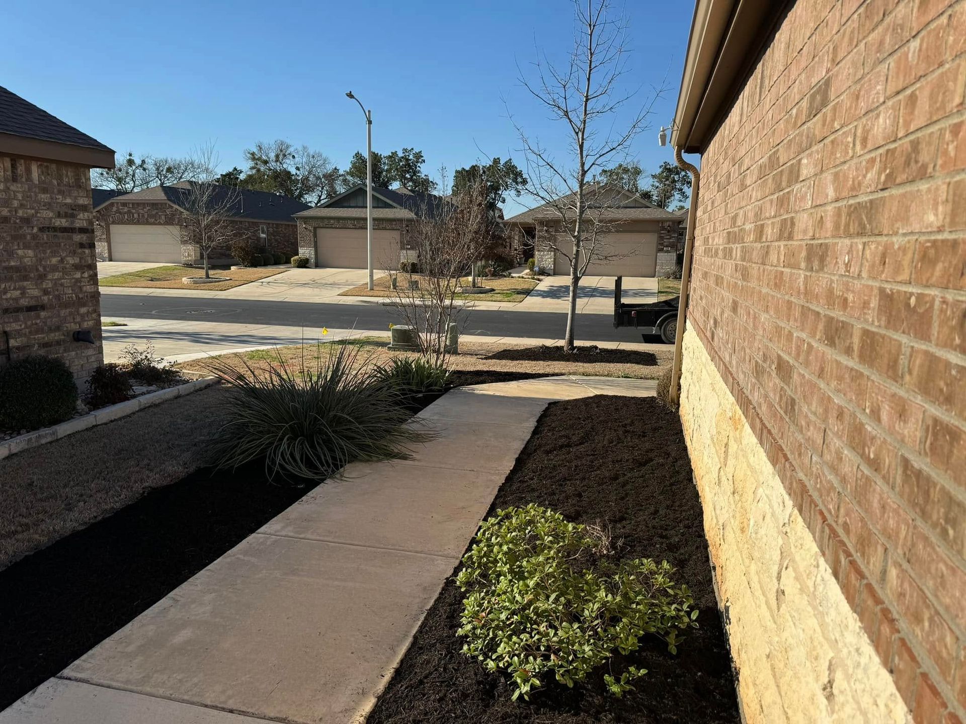 A brick building with a walkway leading to it
