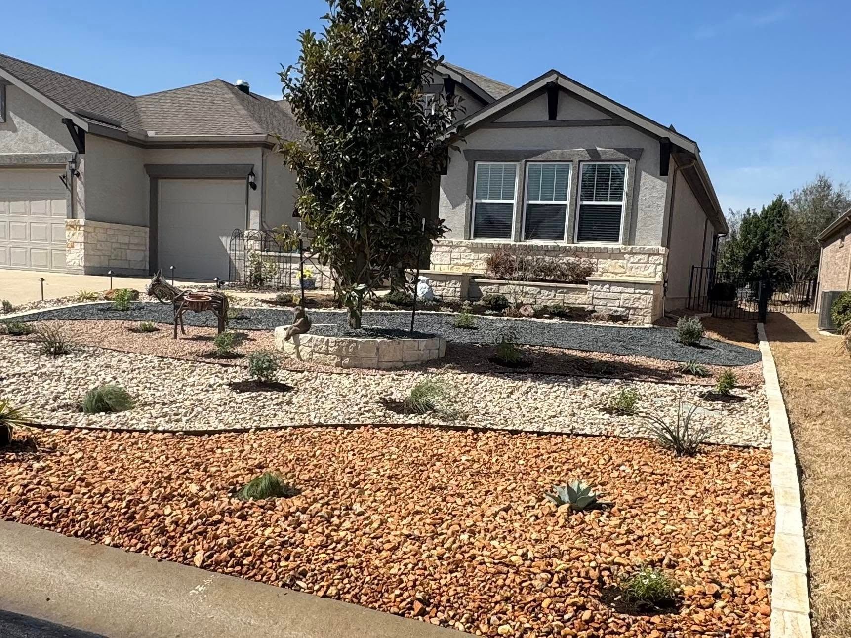 A house with a lot of rocks in front of it