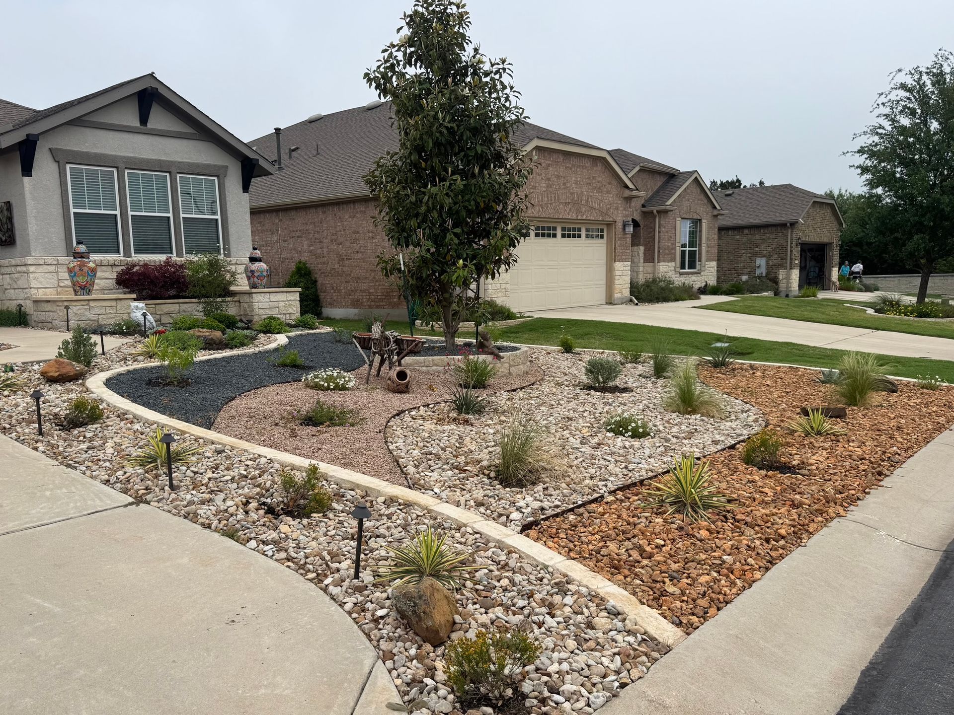 A house with a lot of rocks in front of it 