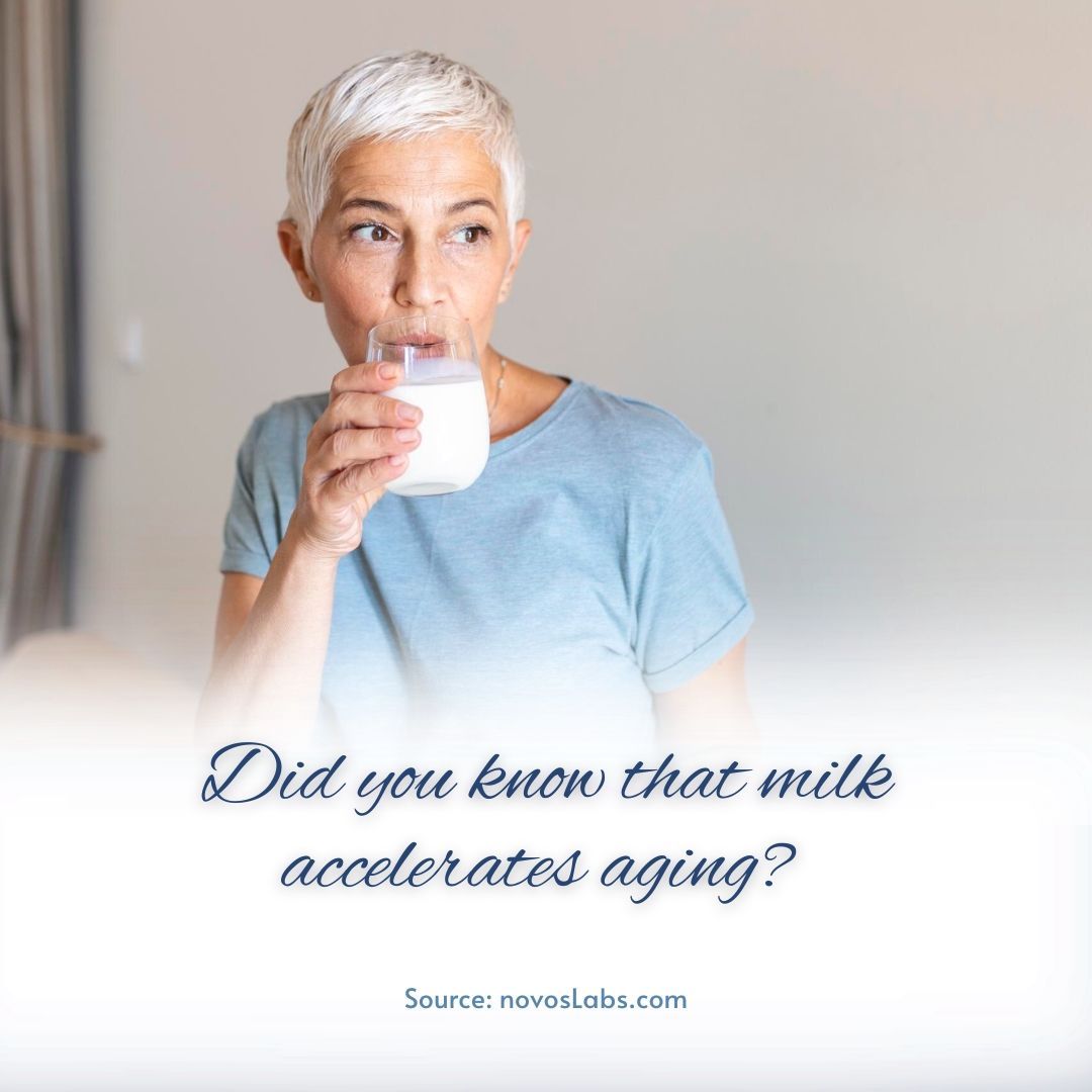 A woman is drinking a glass of milk.