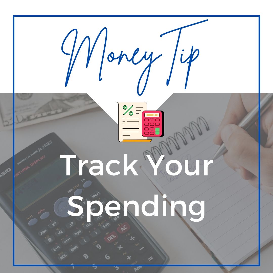 A person is writing in a notebook next to a calculator that says money tip track your spending