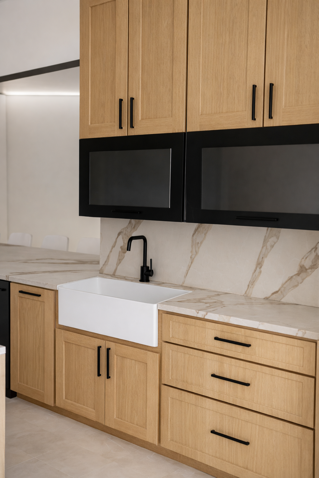 Kitchen cabinets with wood doors, black trim, and a farmhouse sink.