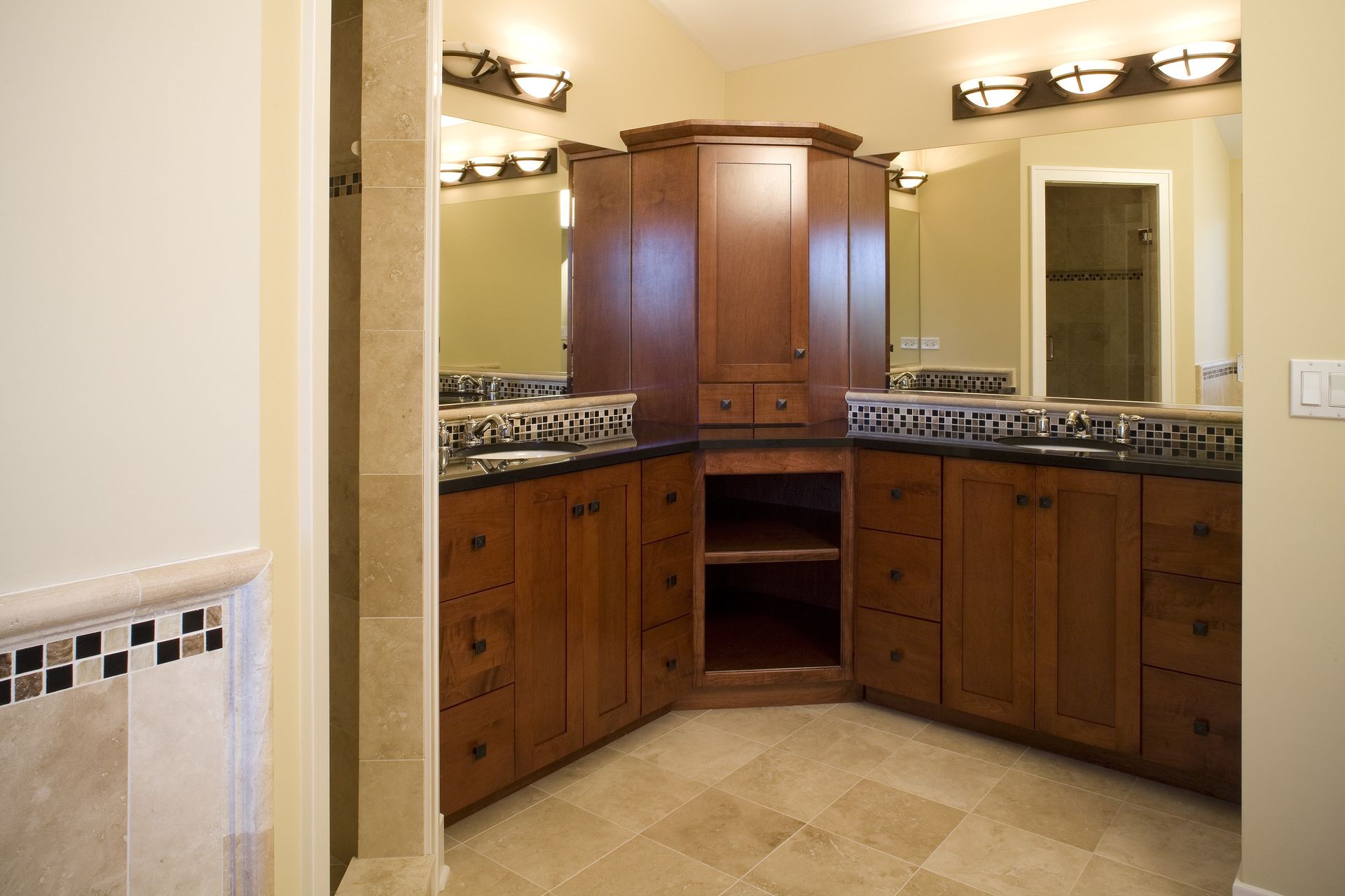 A bathroom with two sinks and a large mirror