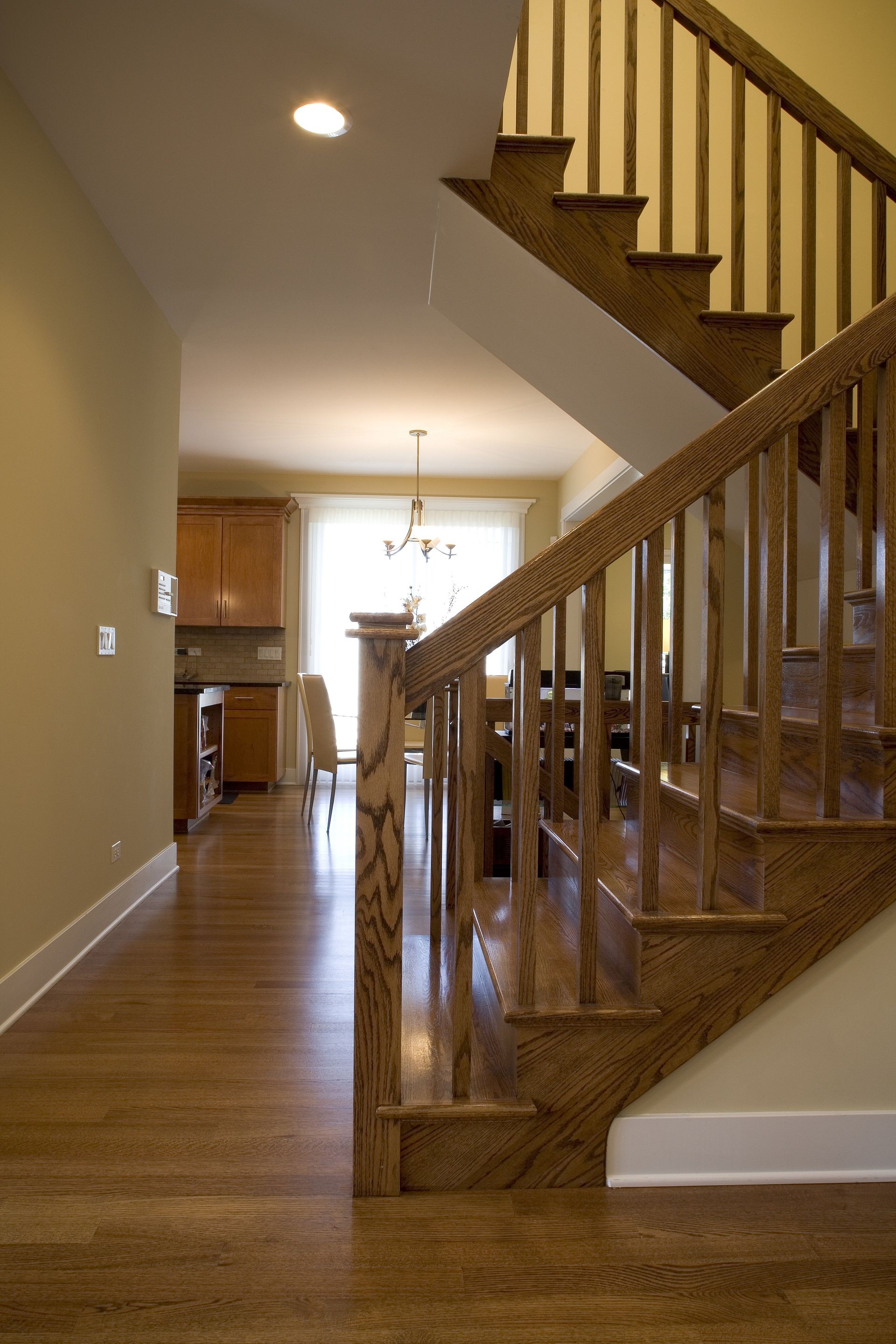 A wooden staircase leading up to the second floor of a house