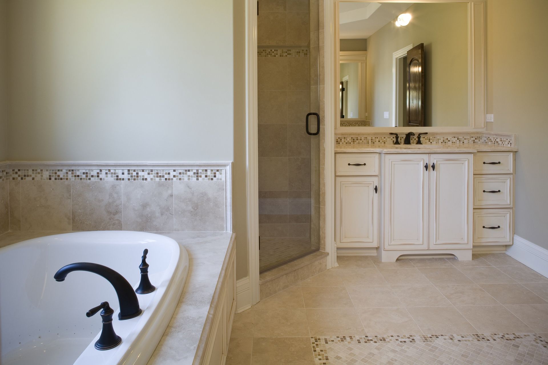 A bathroom with a bathtub and two sinks