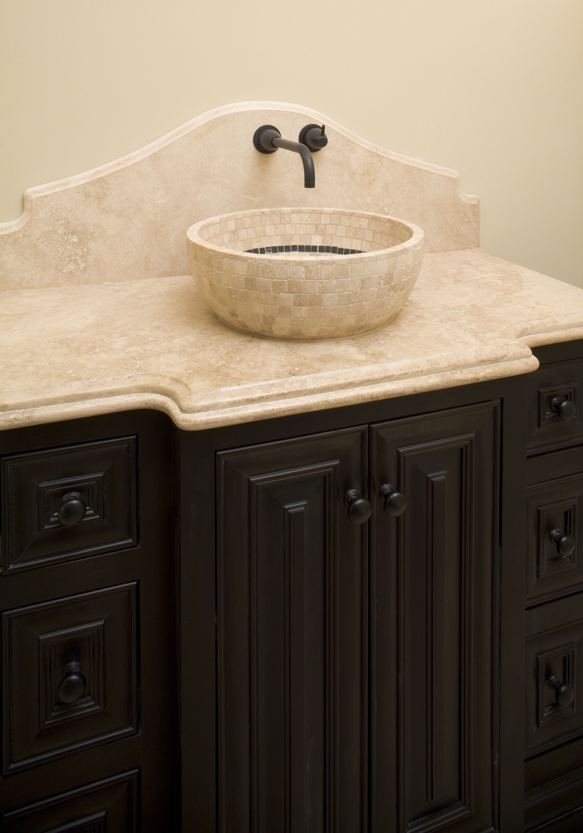 A bathroom vanity with a sink on top of it.