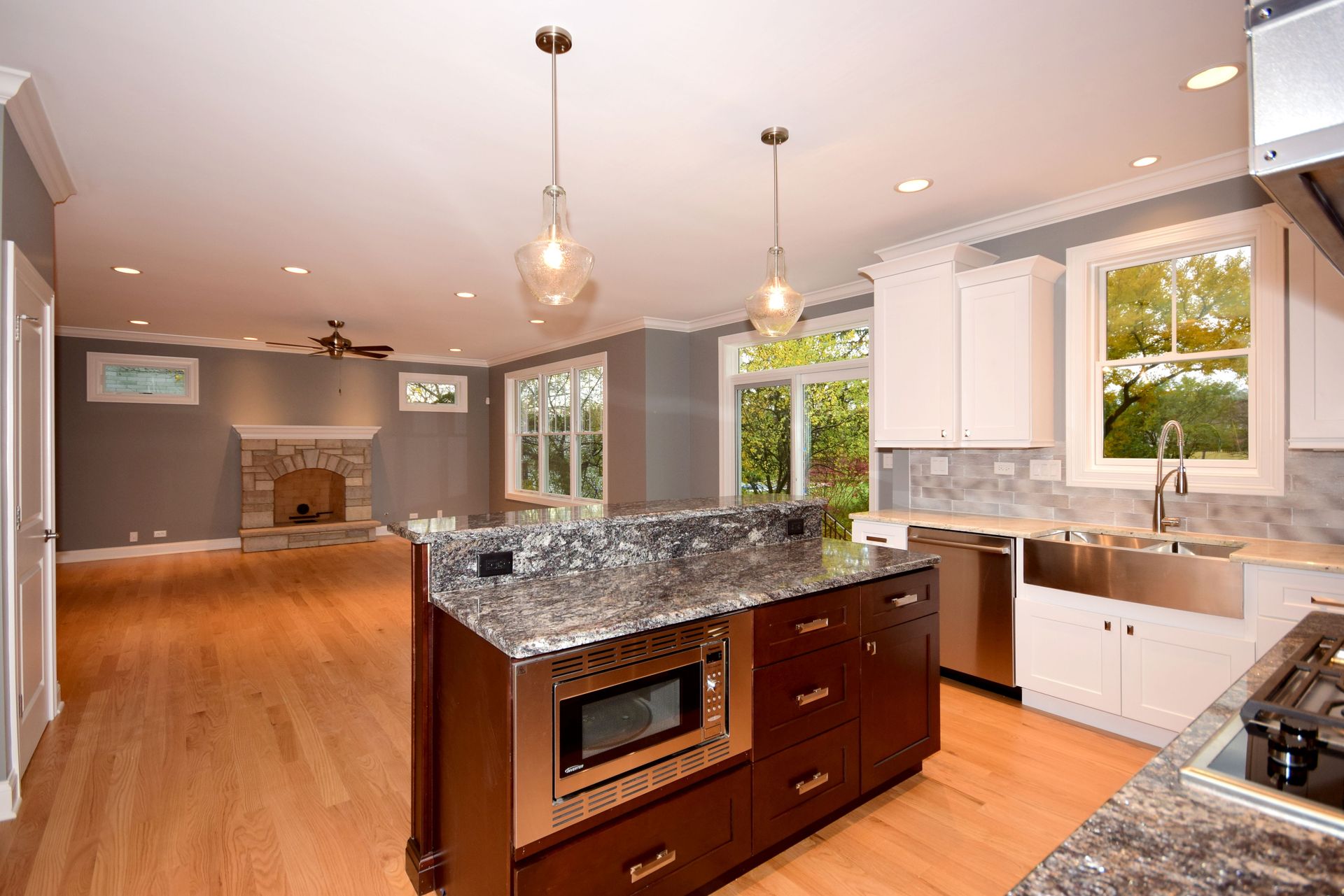 A kitchen with granite counter tops and stainless steel appliances