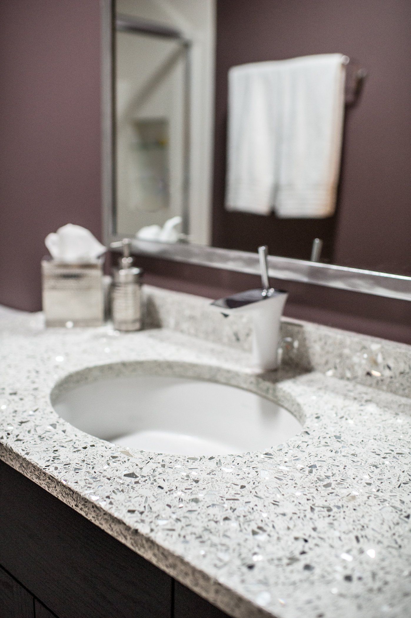 A bathroom with a sink and a mirror.
