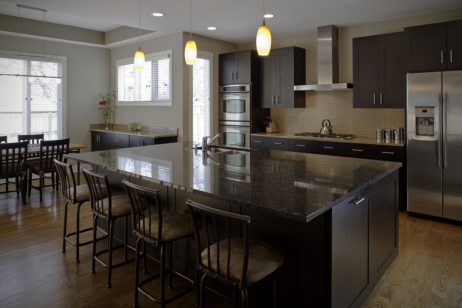 A kitchen with stainless steel appliances and granite counter tops