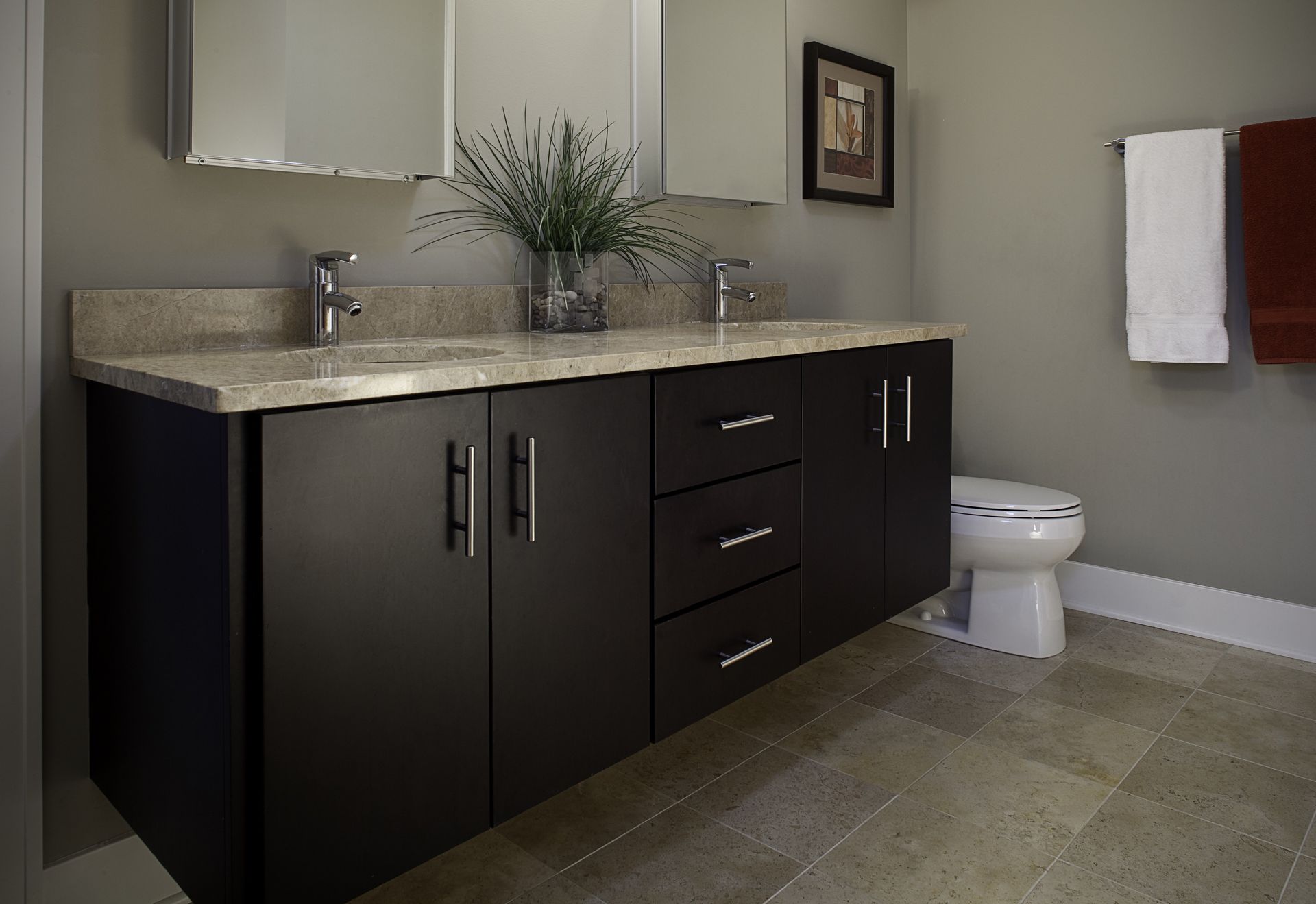 A bathroom with a sink , toilet and mirror