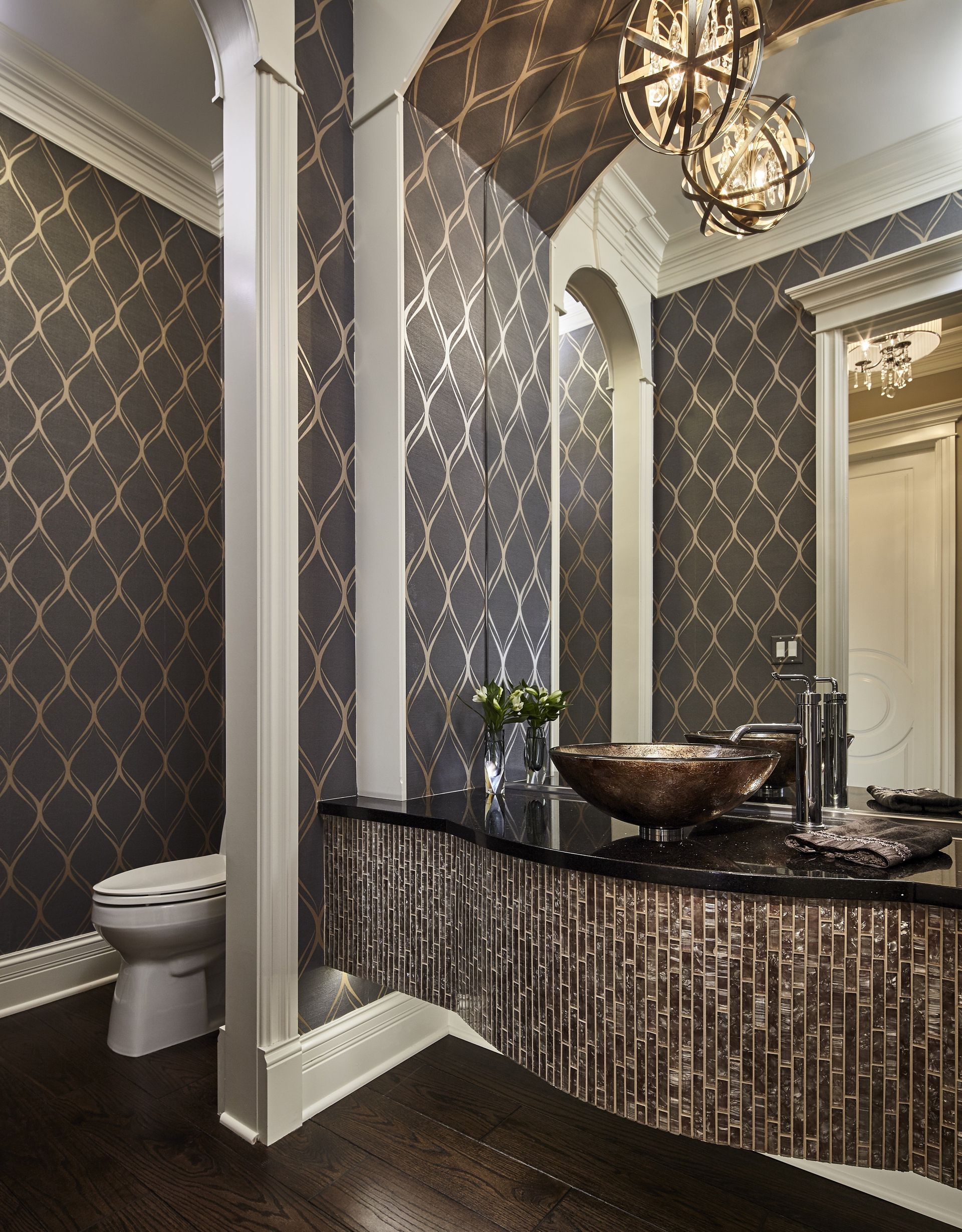 A bathroom with a toilet a sink and a mirror