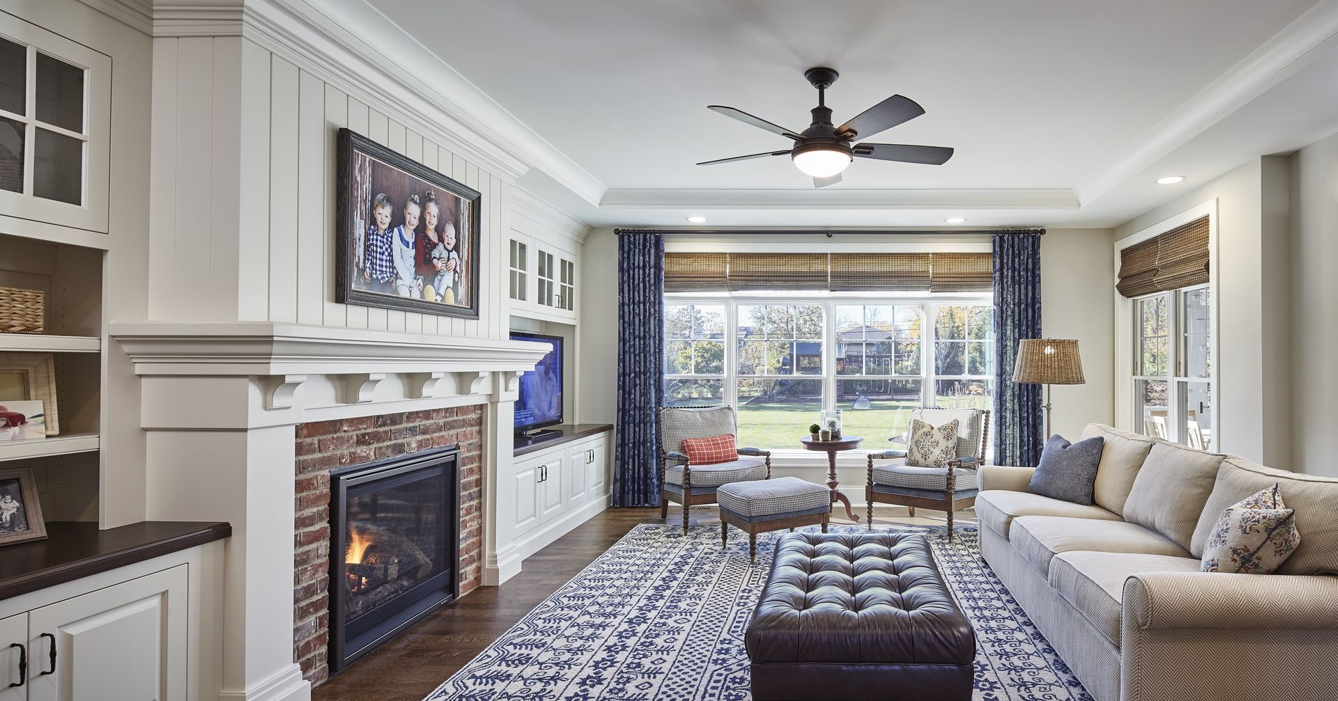 There is a fireplace in the middle of the living room.