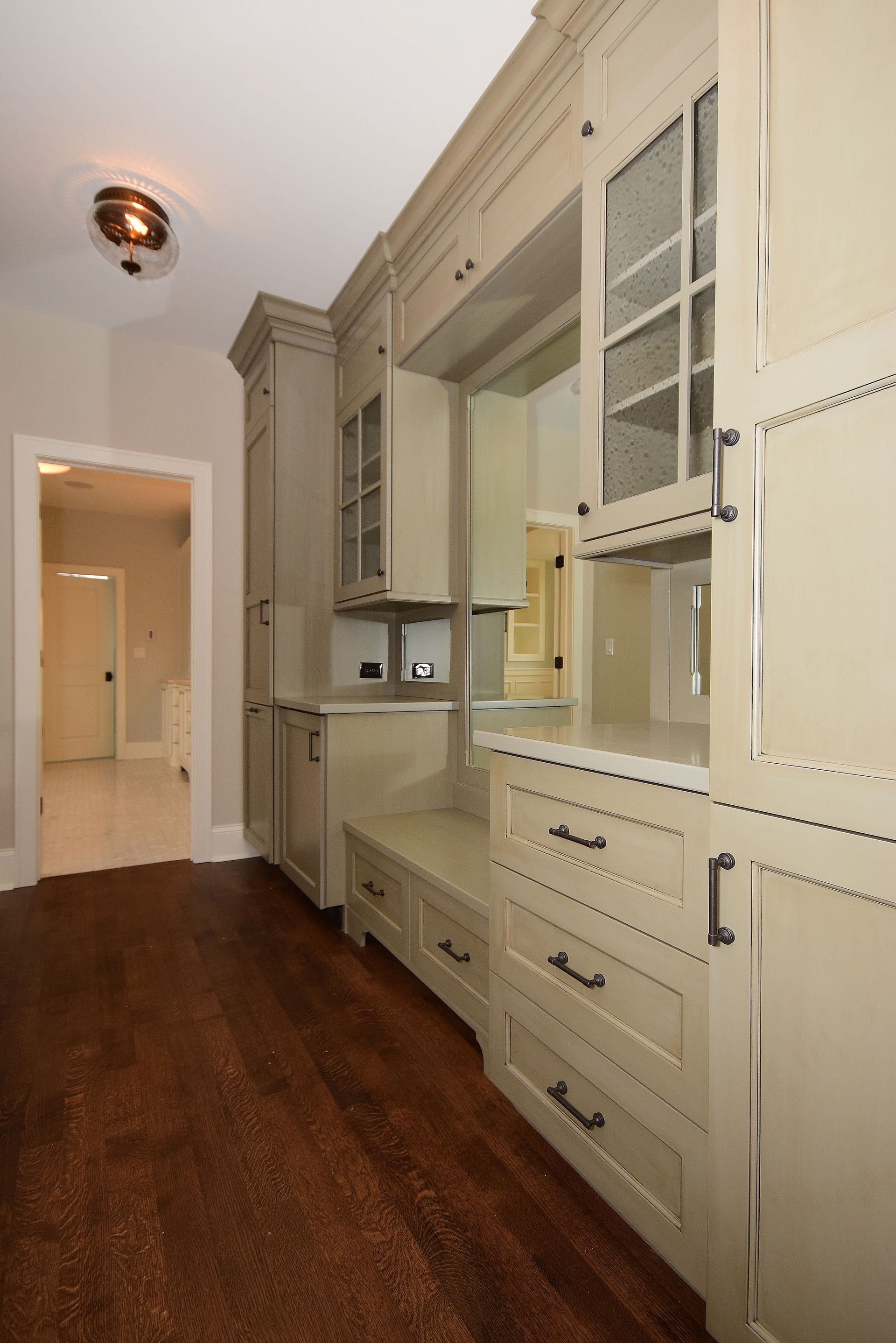 A kitchen with a lot of cabinets and drawers