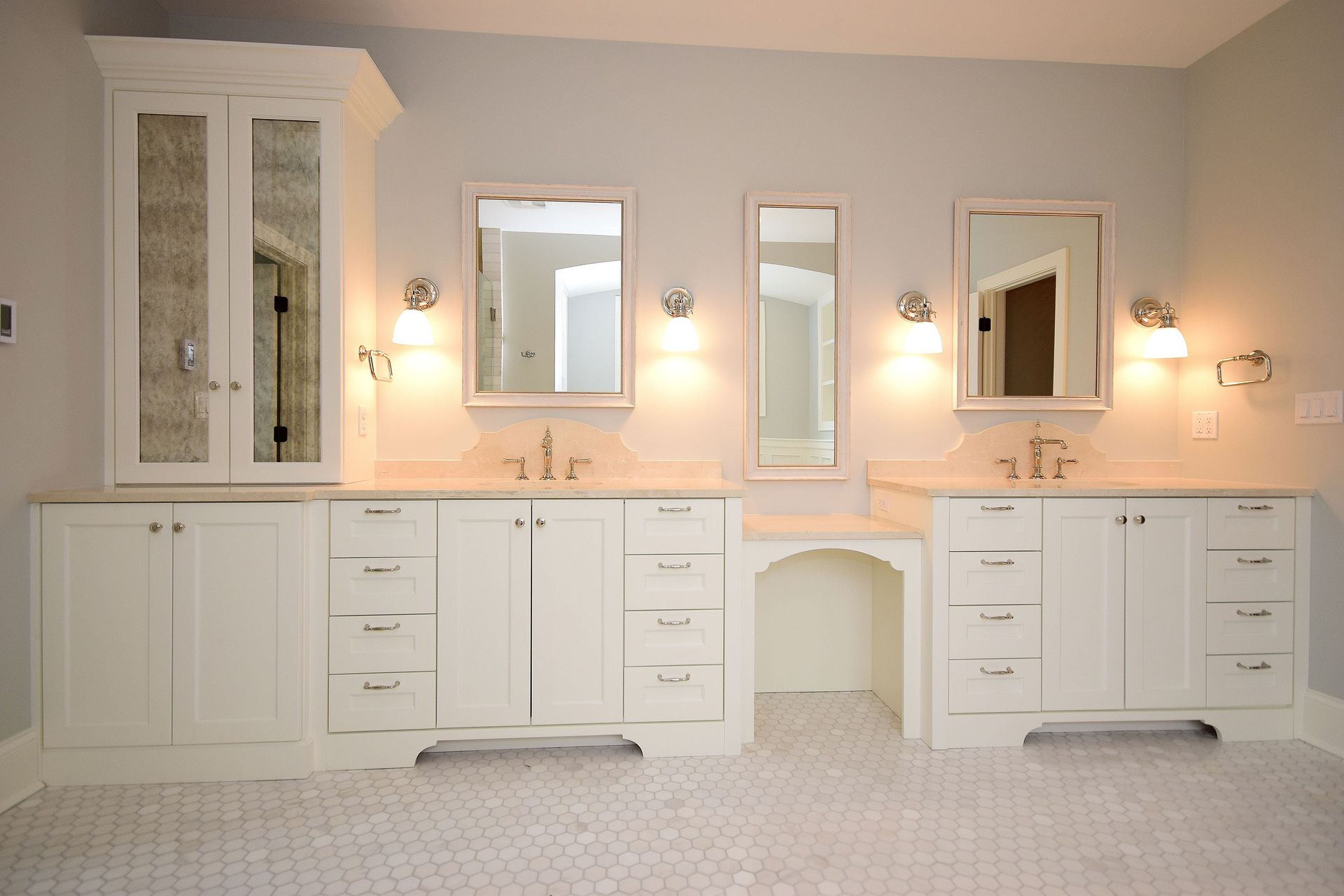 A bathroom with two sinks and two mirrors