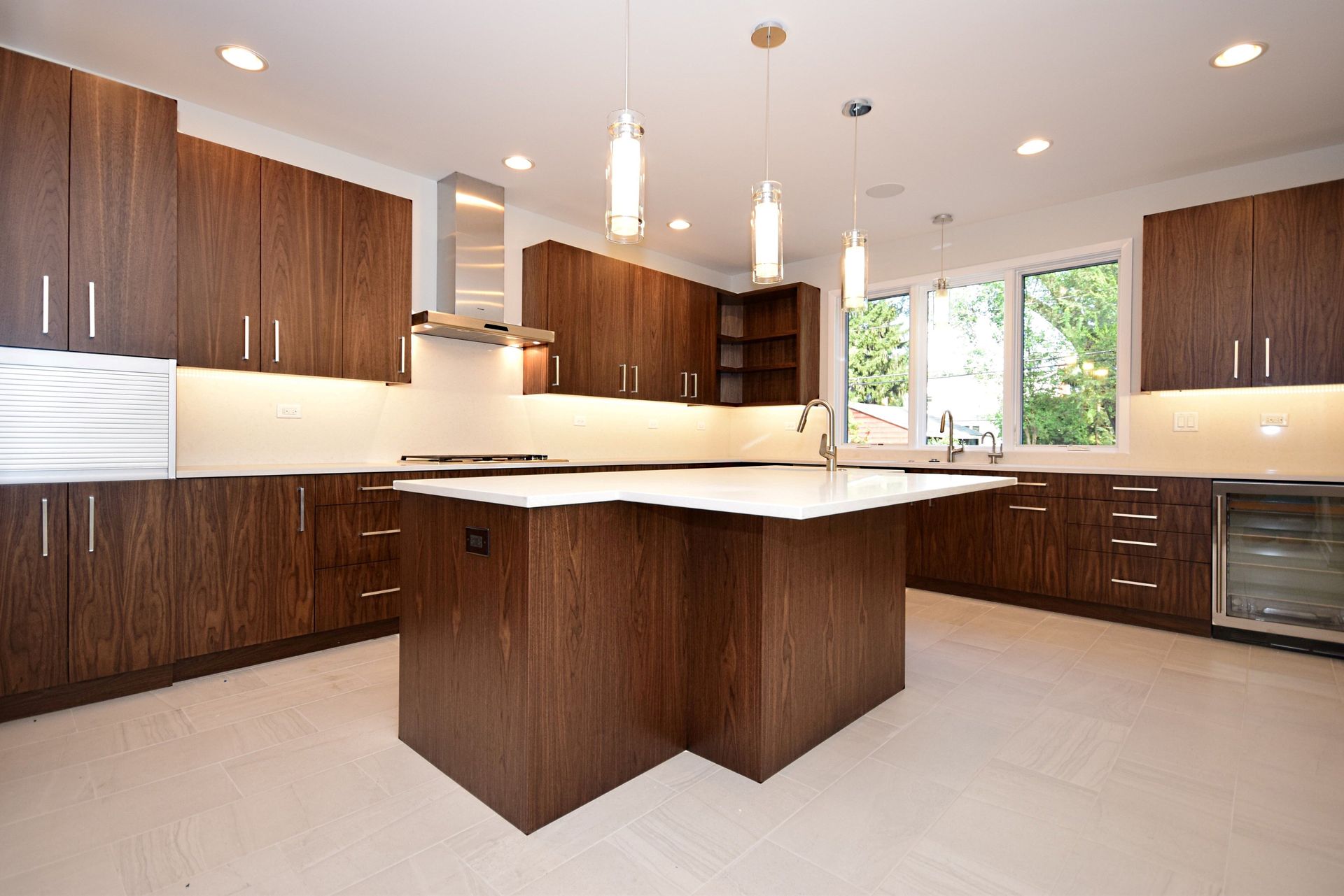 A kitchen with a large island in the middle