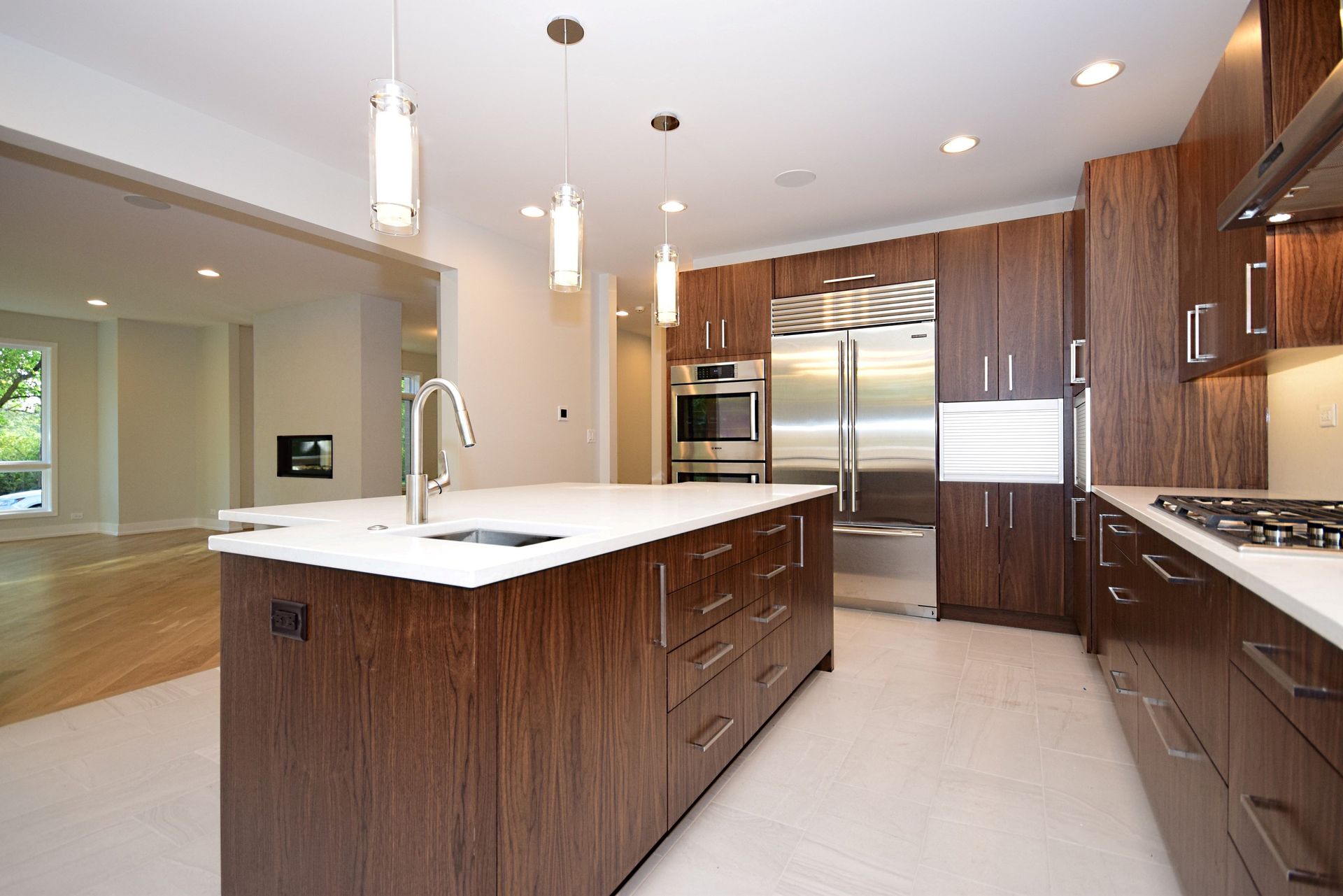 A kitchen with stainless steel appliances and wooden cabinets