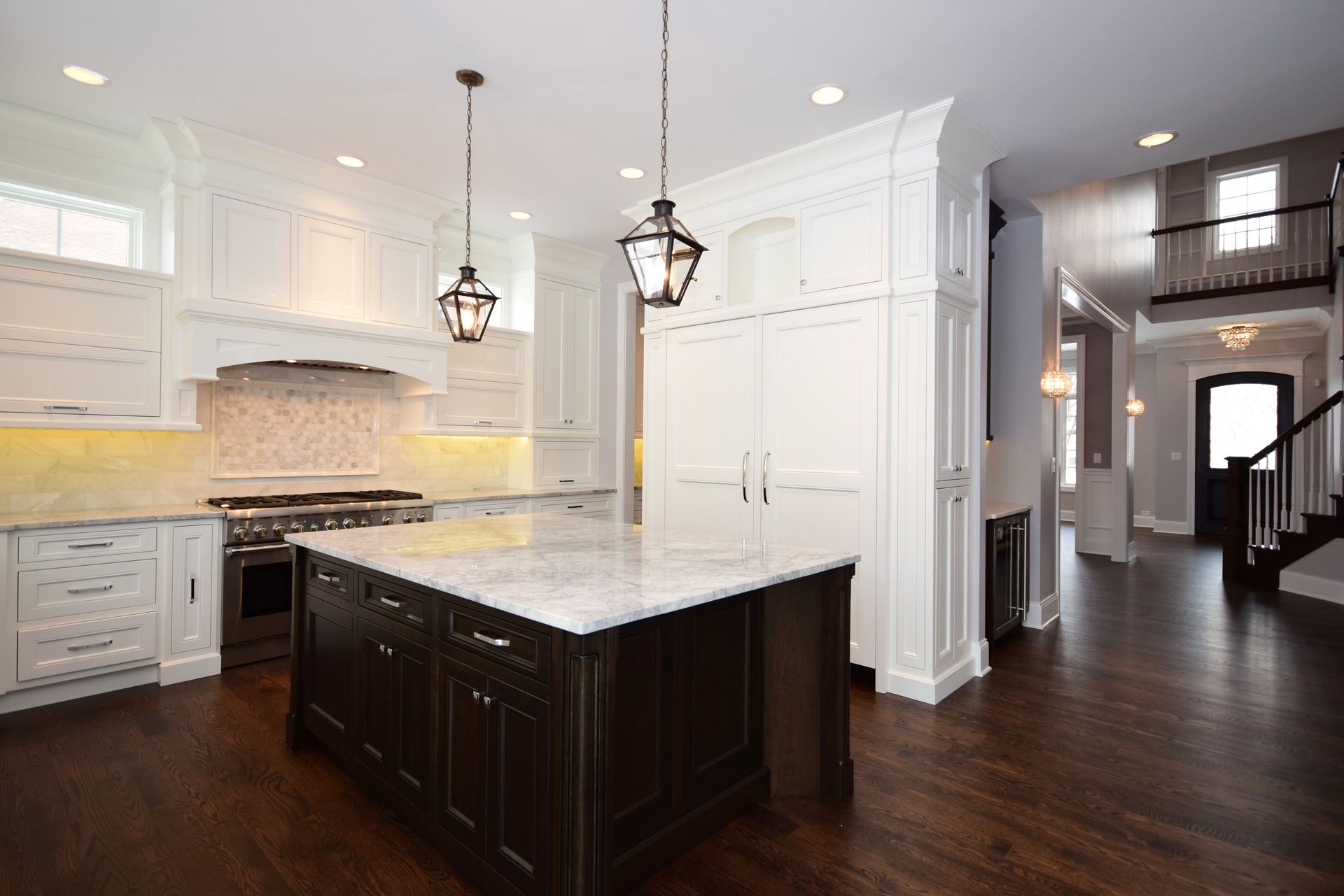 There is a large island in the middle of the kitchen.