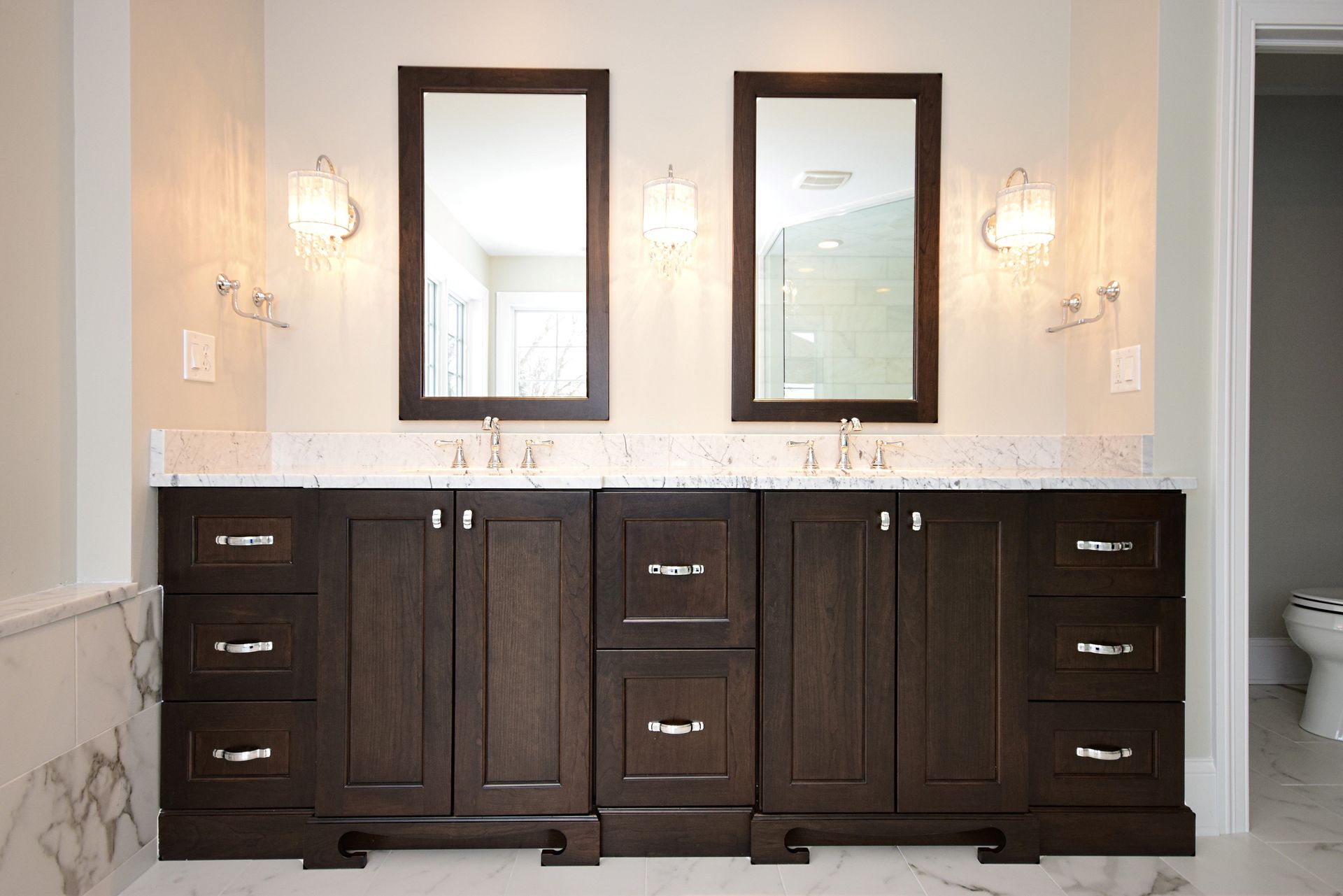 A bathroom with two sinks and two mirrors