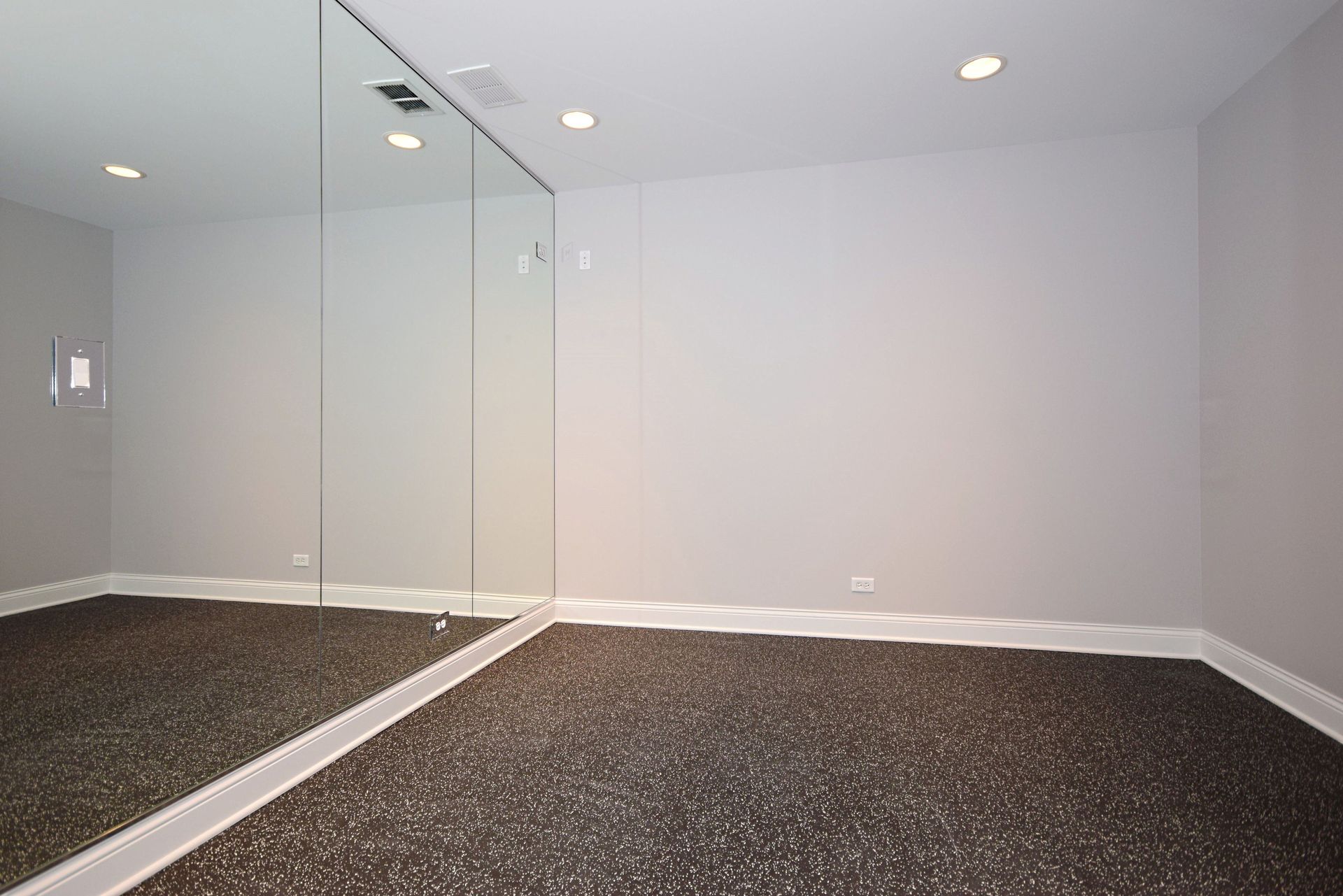 There is a large mirror in the middle of the room.