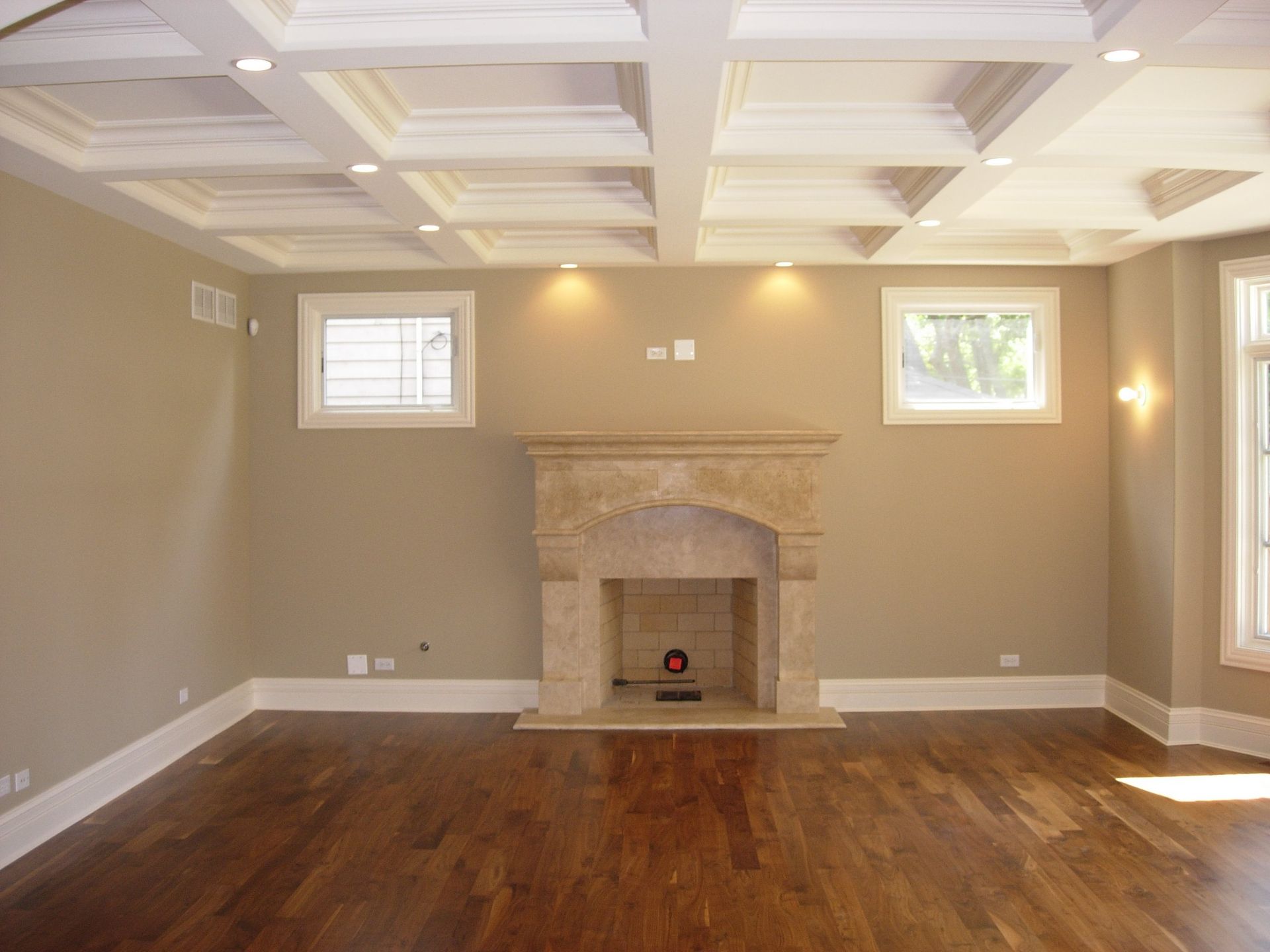 A living room with hardwood floors and a fireplace