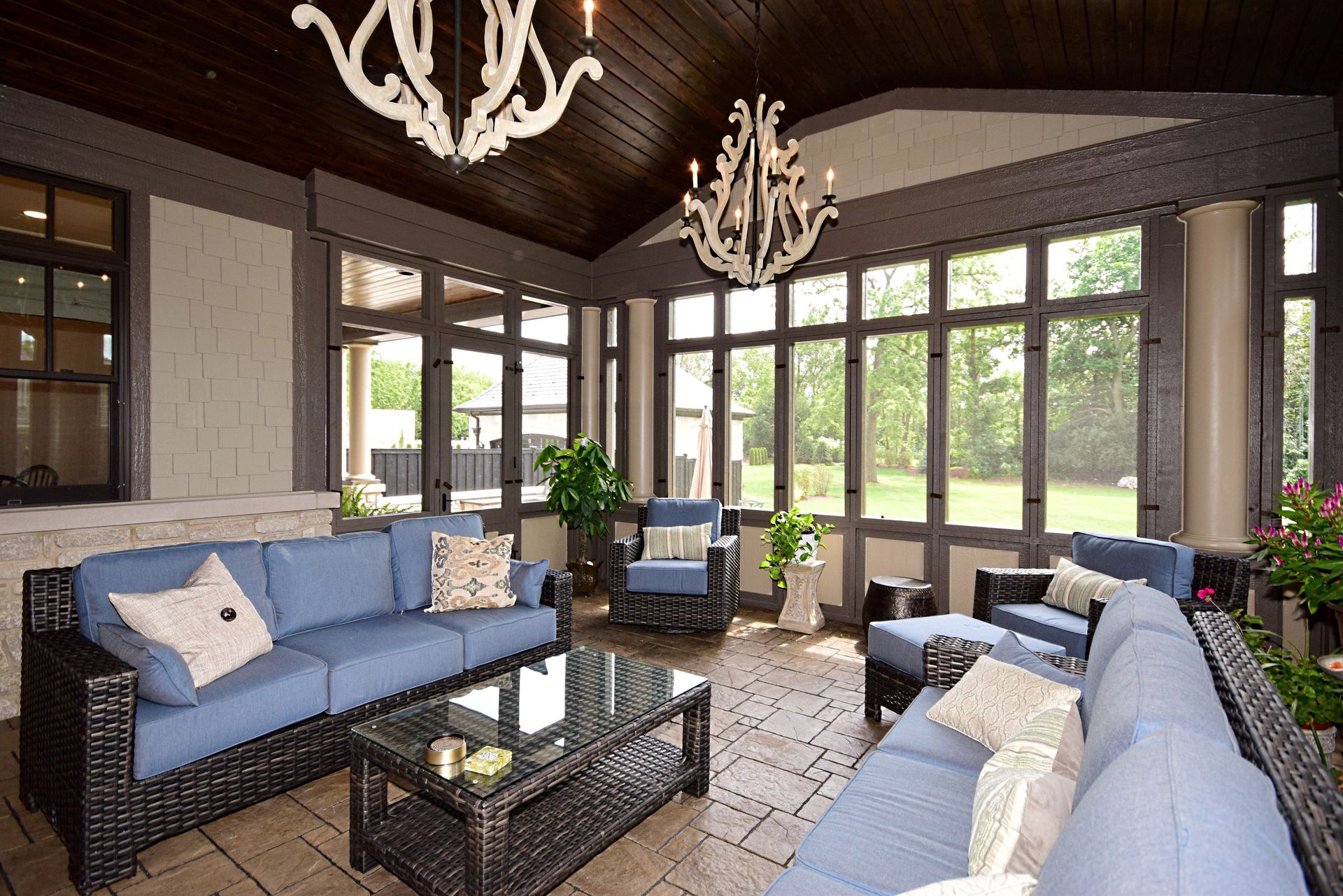 A living room filled with furniture and a chandelier.
