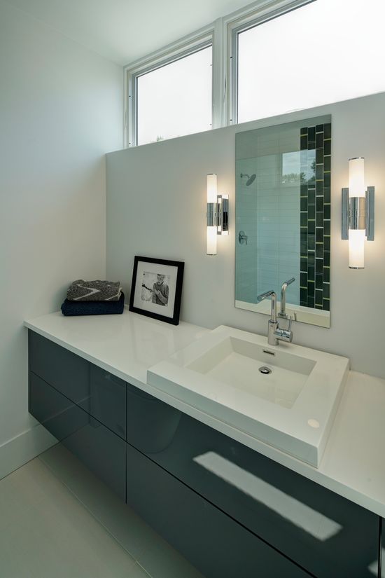 A bathroom with two sinks and a mirror