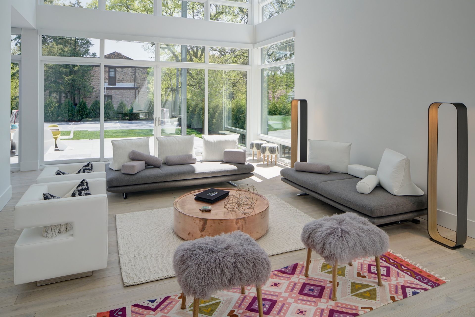 A living room with a lot of furniture and a rug.