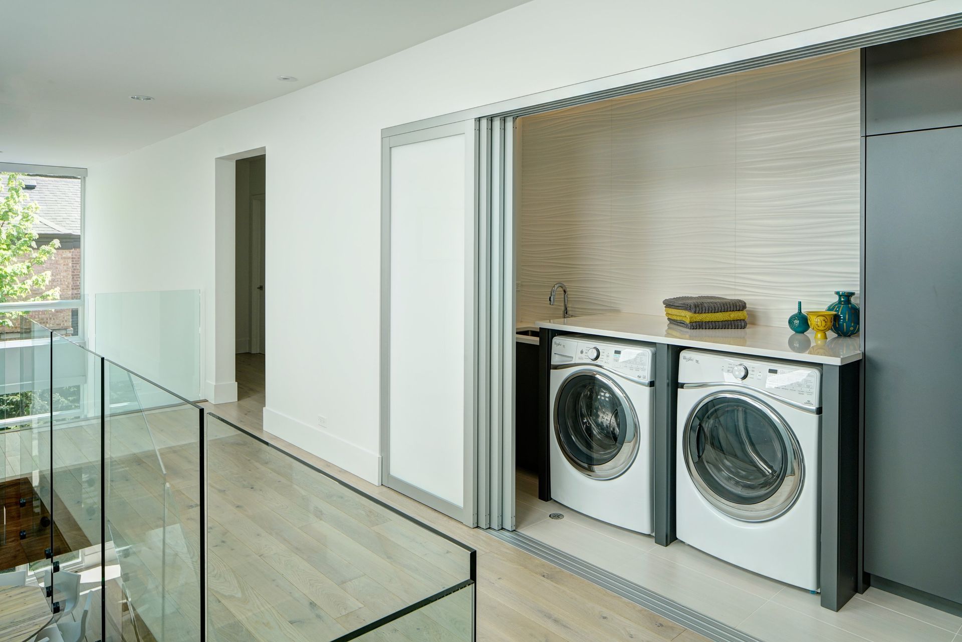 A laundry room with a washer and dryer in it.