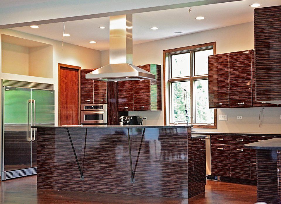 A kitchen with stainless steel appliances and wooden cabinets
