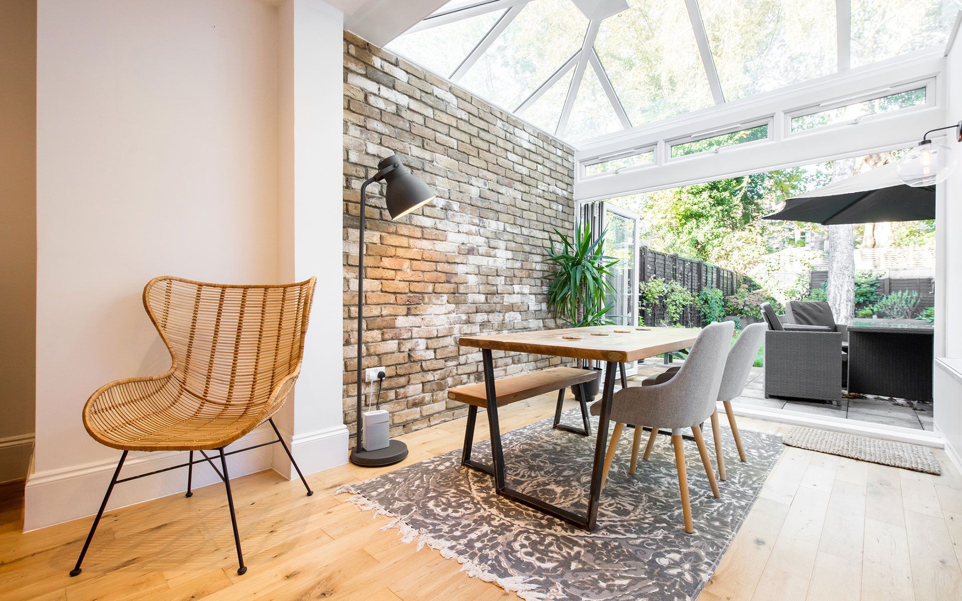 A man is working on the roof of a house.