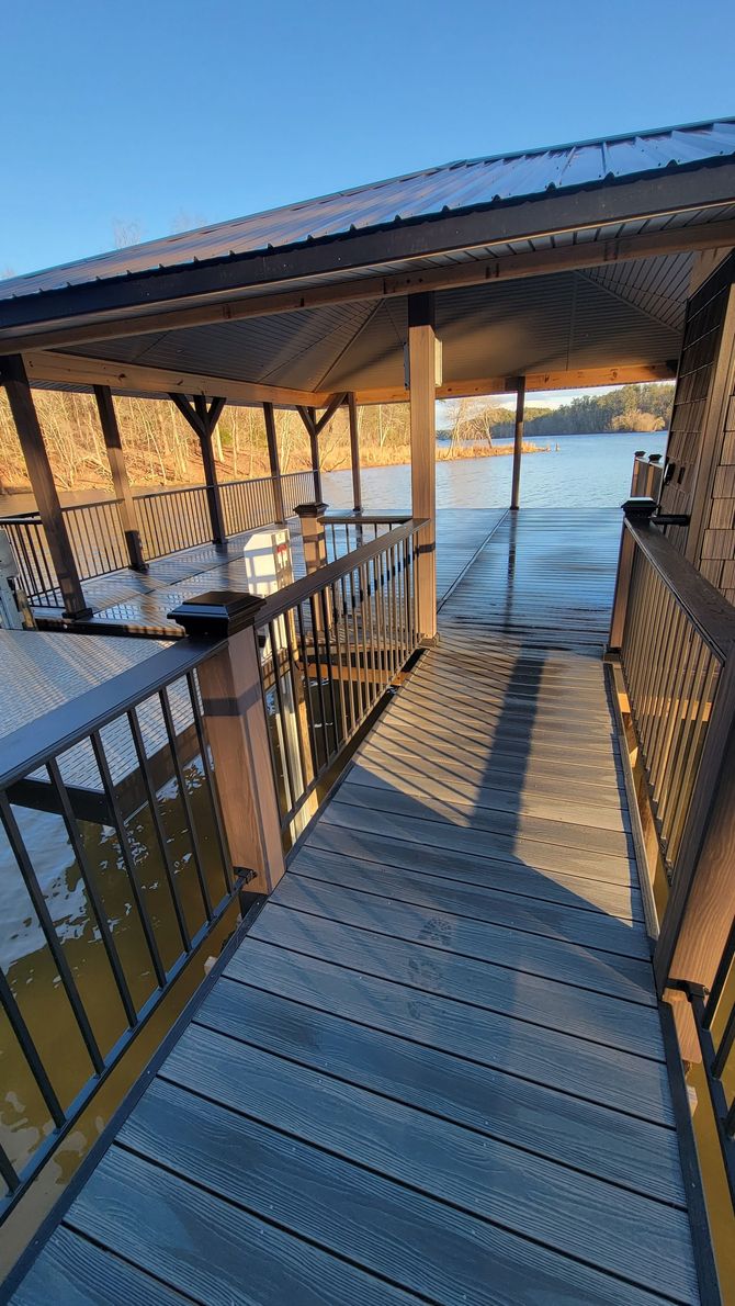A dock with a gazebo overlooking a body of water.