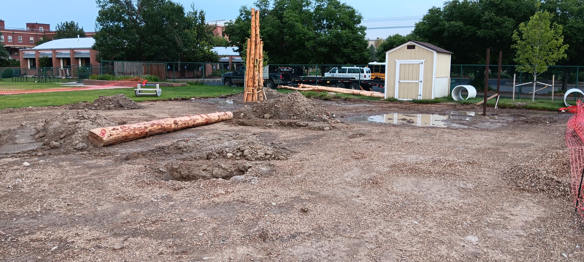 A large pile of dirt is sitting in the middle of a dirt field.