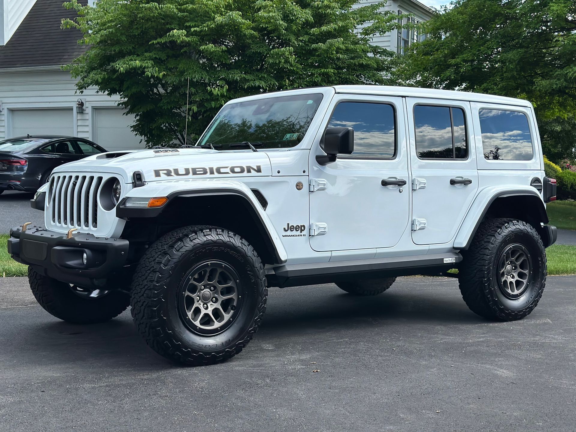 A car with freshly applied auto window tinting services, showcasing the importance of post-installation care for maintaining tint and extending its life.