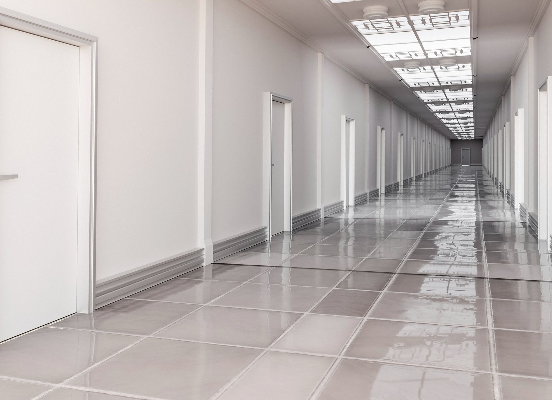 A long hallway with a tiled floor and white walls