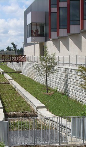 A building with a lot of windows and a fence in front of it