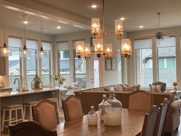 Love is Blinds TX: Motorized Roller Shades in an elegant dining room setting. 